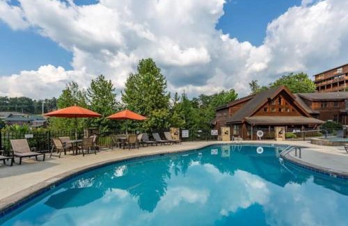 Pigeon Forge House | 2 Miles from Dollywood Family Resort with Seasonal Outdoor Swimming Pool, Year around Heated Indoor Swimming Pool, Townhome Style Cabin, Private Hot Tub, Arcade, TV, Wifi, Kitchen with Refrigerator, Washer and Dryer