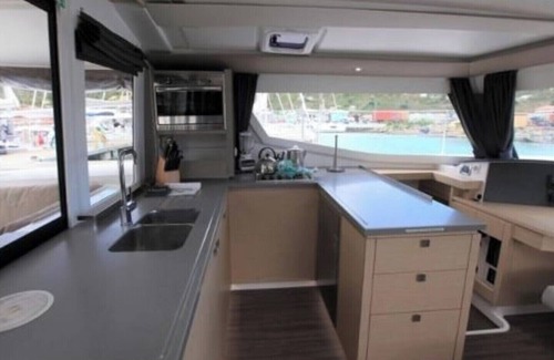 Morne Rouge Boat Rental | 44-foot Luxury Catamaran "SeAtitudes" at Grande Anse Beach in Grenada.