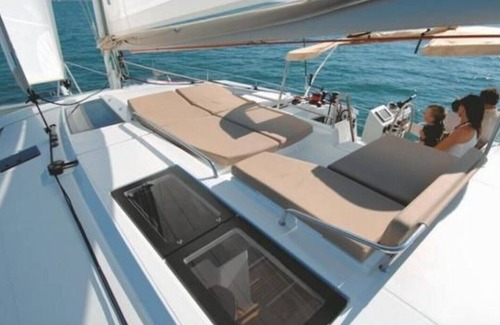 Morne Rouge Boat Rental | 44-foot Luxury Catamaran "SeAtitudes" at Grande Anse Beach in Grenada.