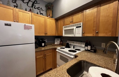 Stratton Mountain Condo | 5 minute walk to lifts and Stratton Village! Cozy fireplace with a private patio