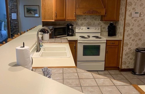 Chalet Village Apartment | 5 Star 3 bd 3ba Serenity Views w Pool Fireplace