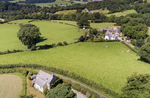 Eglwysbach Cottage | A bedroom, a cabin bedroom, bathroom. Sleeps two guests plus one child. Parking.