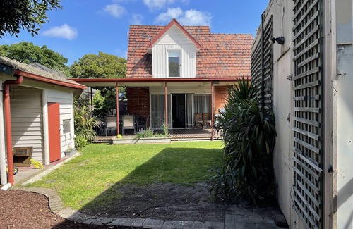 Rosebud Cottage | A charming european cottage close to the beach.