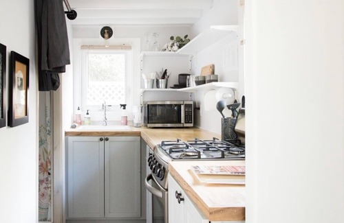 Riverland Terrace House | A sweet tiny house in a great location, with bikes and beach amenities.