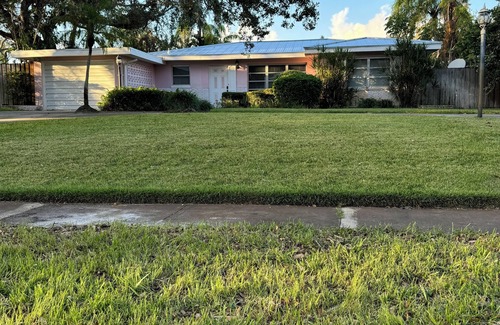 Central Beach House | A tropical retro bungalow secluded area with terrazzo flooring & heated pool.
