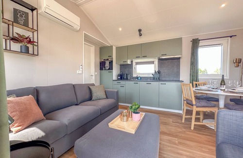 Municipality of Stichtse Vecht Boat Rental | Air-conditioned chalet with waterside terrace