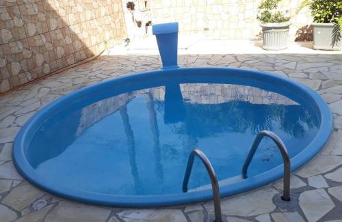Caioba House | Ambiente acolhedor com jardim para pets
