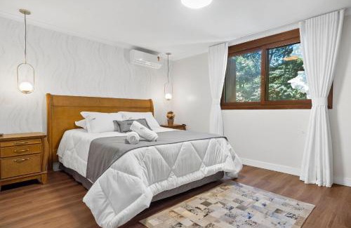 Bairro Lago Negro Apartment | Apartamento Grunerberg 3 Suítes by Achei Gramado