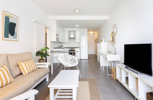 Poris de Abona Apartment | Apartment on the beach, work area and private parking - PillowAbroad