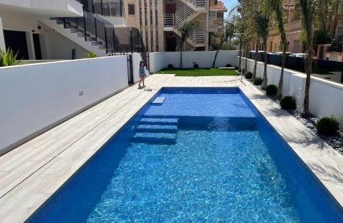 Santiago de la Ribera Apartment | Beach bungalow with swiming pool and long terrace