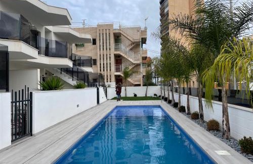 Santiago de la Ribera Apartment | Beach bungalow with swiming pool and long terrace