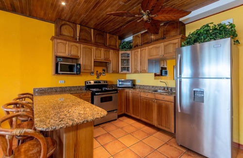 Playa Flamingo Condo | Beachfront Condo with Warm, Rustic Interiors & Direct Access to Playa Flamingo
