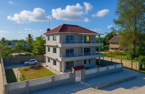 Uroa Apartment | Beachfront Zanzibar Escape 2BR Suites with Balcony WiFi, Uroa