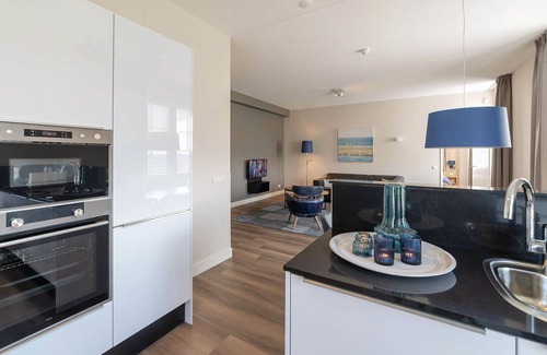 Colijnsplaat Apartment | Beautiful apartment for 4 guests with hot tub, WIFI, TV, balcony and parking