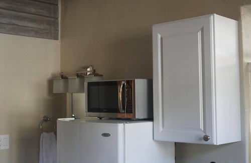 City Park West Apartment | Beautifully Remodeled, private w/walkout to back yard with air conditioning.