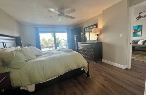 Capri Isle Apartment | Beautifully renovated waterfront owners unit!