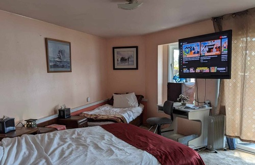 Marrowstone Cabin | Bed and a twin bed, bedroom individual, entrance and exit to private beach