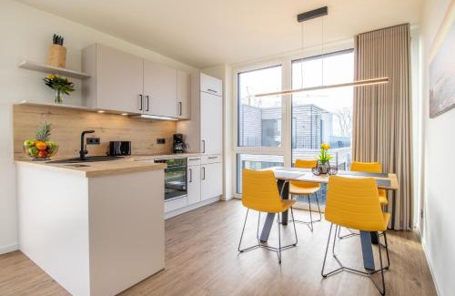 Marienleuchte Apartment | BeltBlick 24 – Moderne Ferienwohnung mit Dachterrasse und Meerblick!