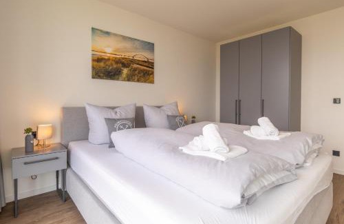 Marienleuchte Apartment | BeltBlick 24 – Moderne Ferienwohnung mit Dachterrasse und Meerblick!