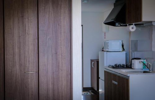 Maeganeku Apartment | Blue Entrance