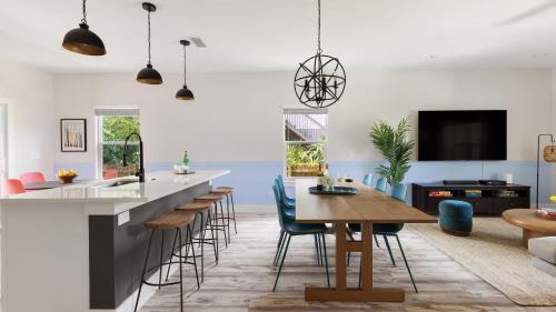Vilano Beach House | Blue Hour Playfully Designed Beach Home w Hot Tub Fire Pit Game Room