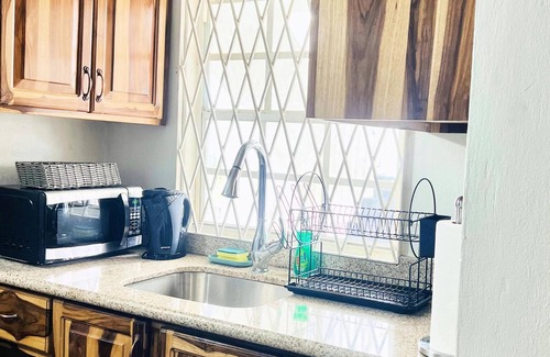 Molynes Gardens Condo | Blue Laventura cozy condo with WiFi and AC in enchanting Kingston