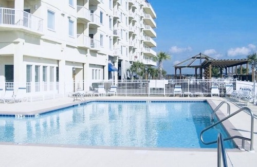 Morehead City Boat Rental | Boat with all the amenities: pool, hot tub, gym, beach, & wild horses
