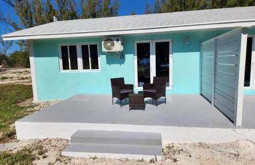 Rock Sound Apartment | By the Bay - Brand New Apartment, Steps to the Sea, Walk to Town apts