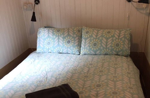 Cenarth House | Caban Bach - The Little Cabin. Cosy cabin with huge sunny deck.