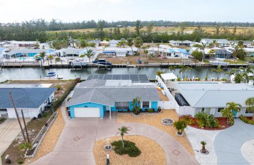 Whitney Beach House | Canalfront Bradenton home with Dock & Heated Screened In Pool