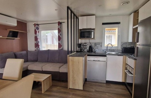 Canet-Plage RV Rental | Caravan 'Cosy Vue Sur L'étang' with Sea View, Shared Pool and Air Conditioning