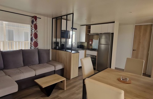 Canet-Plage RV Rental | Caravan 'Cosy Vue Sur L'étang' with Sea View, Shared Pool and Air Conditioning