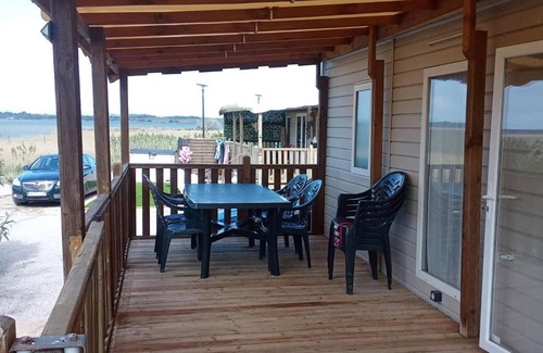 Canet-Plage RV Rental | Caravan 'Cosy Vue Sur L'étang' with Sea View, Shared Pool and Air Conditioning