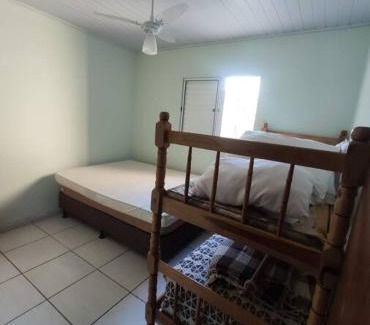 Guaratuba House | Casa Arejada com piscina para momentos em família