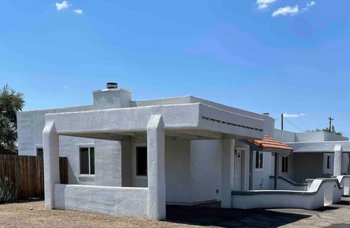 Limberlost House | Casita A: Private fenced yard with grill, turf, outdoor dining and seating.