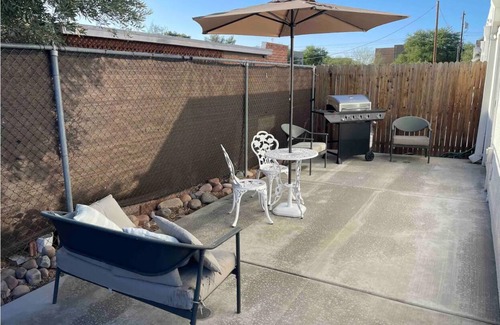 Limberlost House | Casita A: Private fenced yard with grill, turf, outdoor dining and seating.