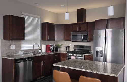 Spokane House | Centrally located Grand Bedroom for you to experience home away from home.