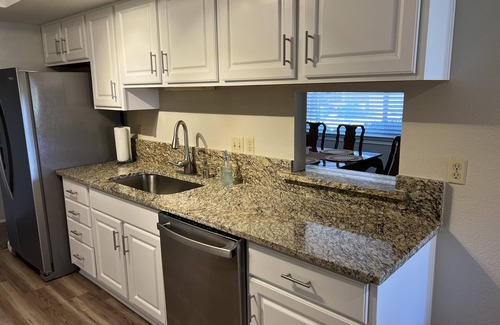West University House | Centrally located to everything Reno! Family home w/arcade games & full patio.