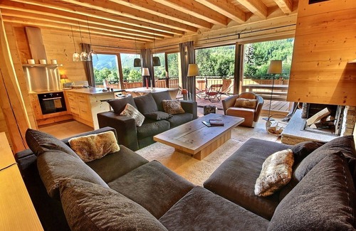 Le Serre Barbin Ski Chalet | Chalet Prestige full sun fireplace garden terrace view serrechevalierholidays