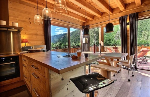 Le Serre Barbin Ski Chalet | Chalet Prestige full sun fireplace garden terrace view serrechevalierholidays