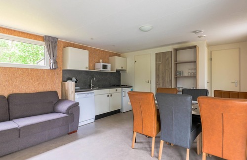 Vessem Ski Chalet | chalet with covered terrace on campsite with pool