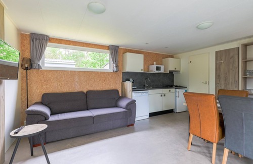 Vessem Ski Chalet | chalet with covered terrace on campsite with pool