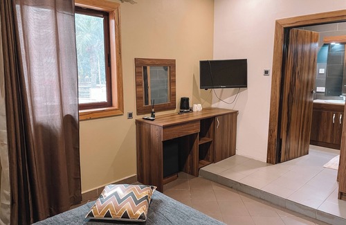 Cantonments Hotel | Charming hotel room in Osu