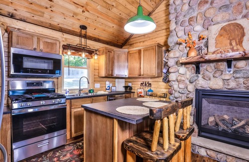 Eagle River Cabin | Charming, lakefront home with a gas fireplace, docks, firepit, & full kitchen