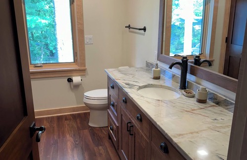 Shawano Hotel | Charming new lake house with beautiful views. Pier for swimming and fishing.