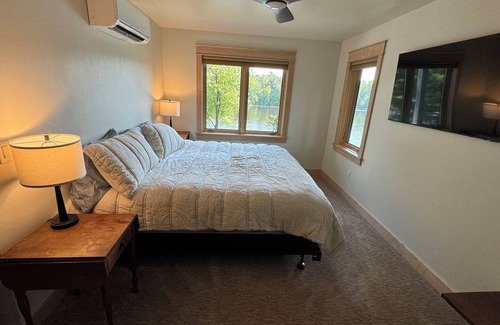 Shawano Hotel | Charming new lake house with beautiful views. Pier for swimming and fishing.