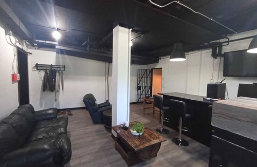 Algoma District Apartment | Charming Prohibition-Era Speakeasy Lounge with Bedroom and Commercial Kitchen