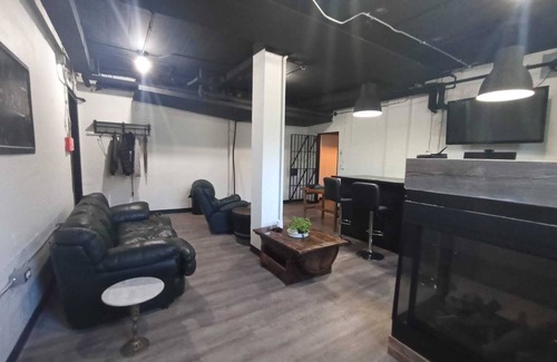 Algoma District Apartment | Charming Prohibition-Era Speakeasy Lounge with Bedroom and Commercial Kitchen