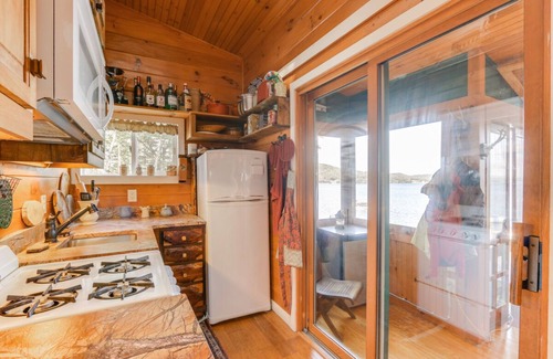 Laconia Cottage | Charming waterfront cottage at Weirs Beach with shared dock and WifI