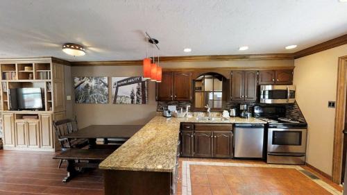 Red River House | Claim Jumper Townhouse 02 - On the River - Across from the Fishing Ponds - WiFi - Cable - Near Ski Area - Wood Burning Fireplace